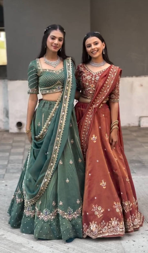 Harshita Emerald Green & Rust Maroon in Intricate Zari Embroidery with Stone Lehenga Choli