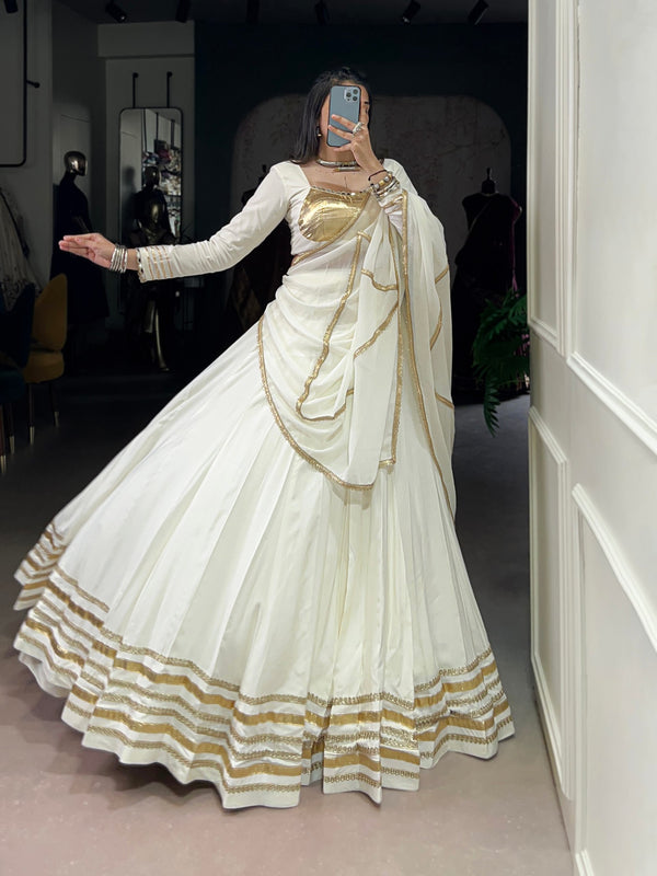 Rhea’s Ethereal Look White & Gold Flow Lehenga Set for Regal Evenings